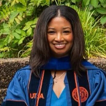 Portrait of Dr. Alyse Gray Parker in blue graduation gown